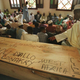 Guinean mourners hold an Islamic ceremony by the pine casket of Amadou Diallo at the main mosque in Conakry, Guinea Feb. 16, 1999. Diallo was gunned down Feb. 4, 1999 in New York City by four plainclothes police officers.